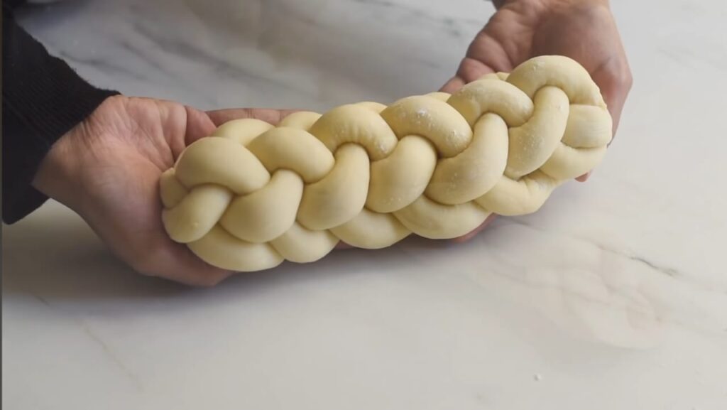 Shape the honey raisin challah